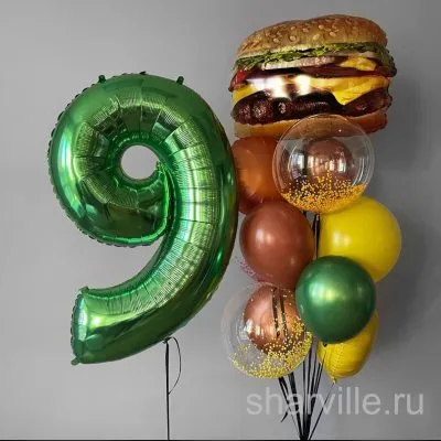Композиция с чизбургером и цифрой в зелёных, жёлтых и коричневых тонах